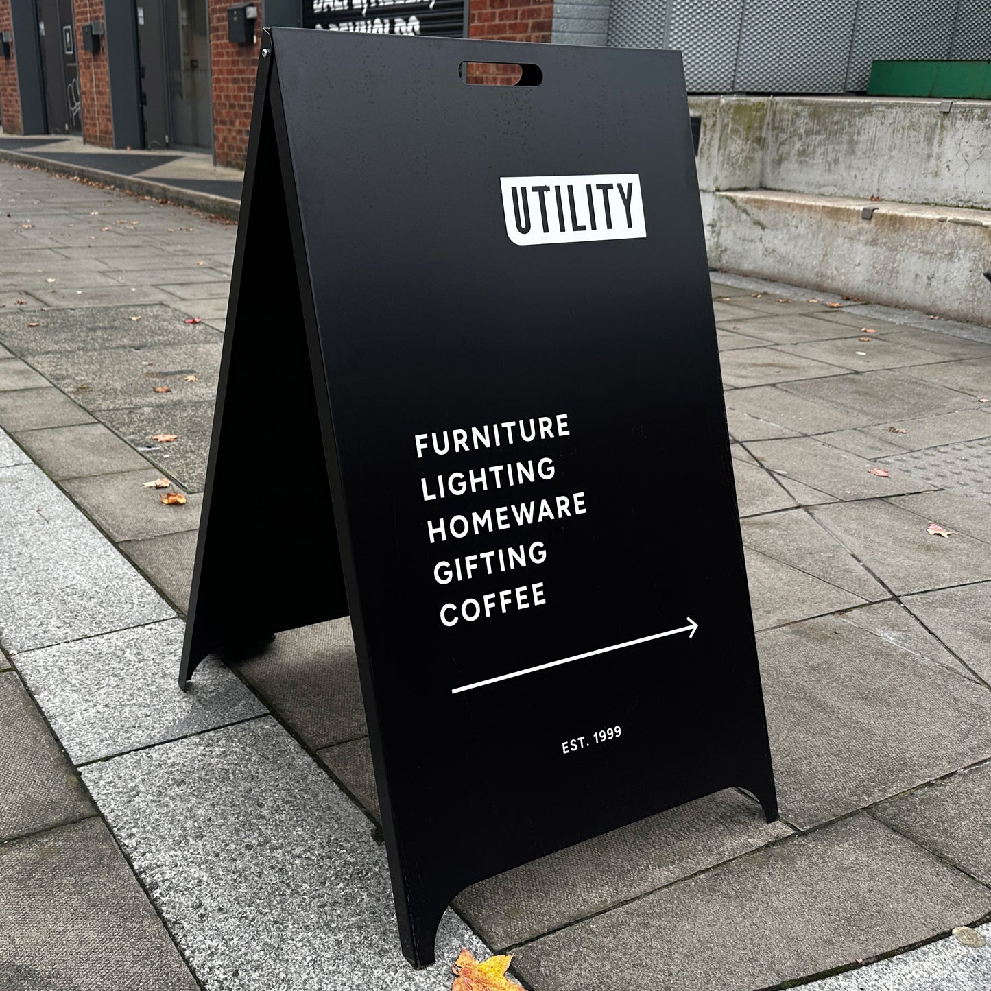 black metal pavement sign